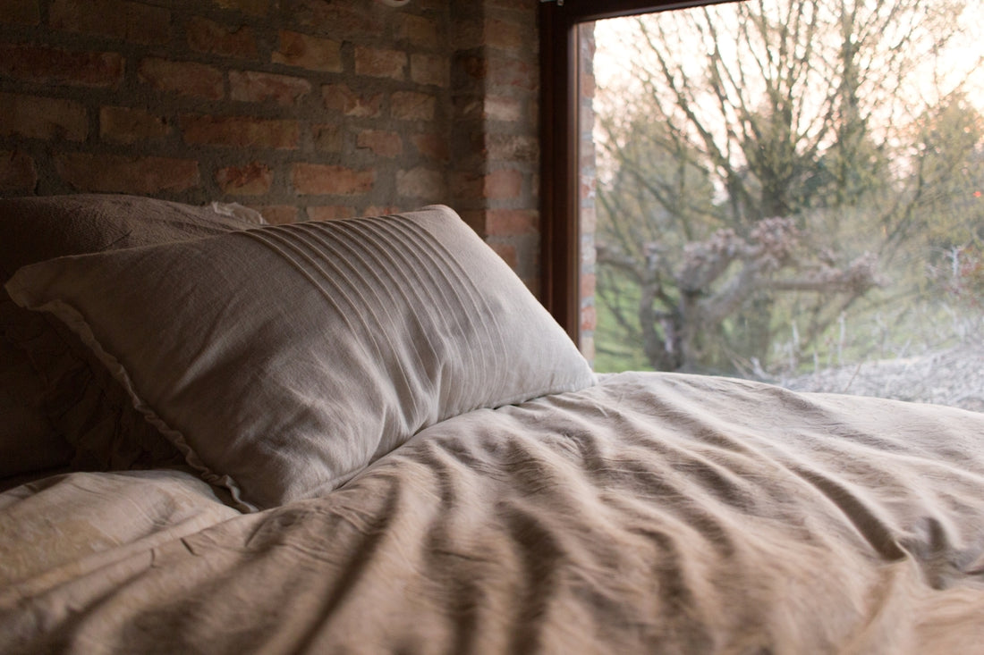pillow on bed near window