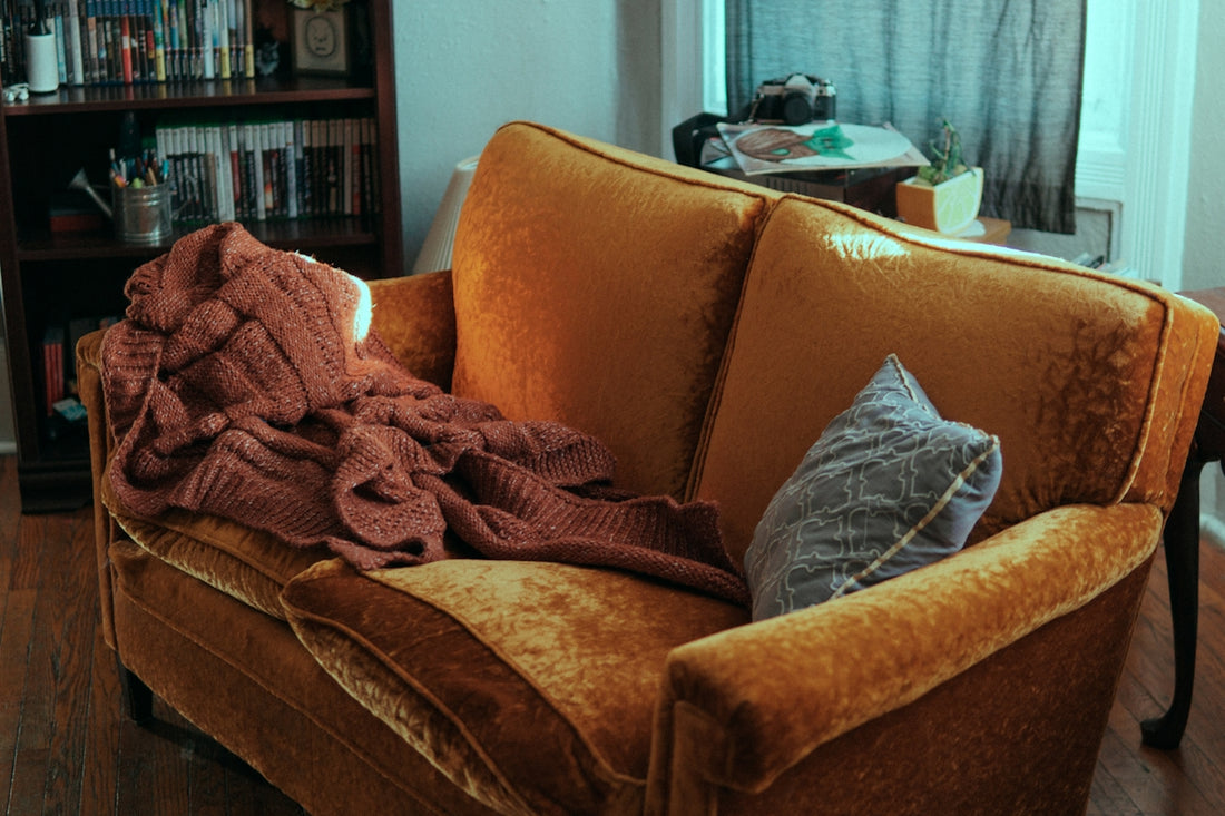 blanket and pillow on sofa
