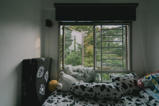 white and black polka dot throw pillows on black and white polka dot sofa
