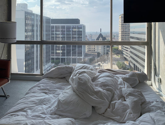 white bed linen on bed