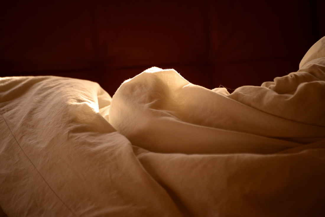 white textile on brown wooden table